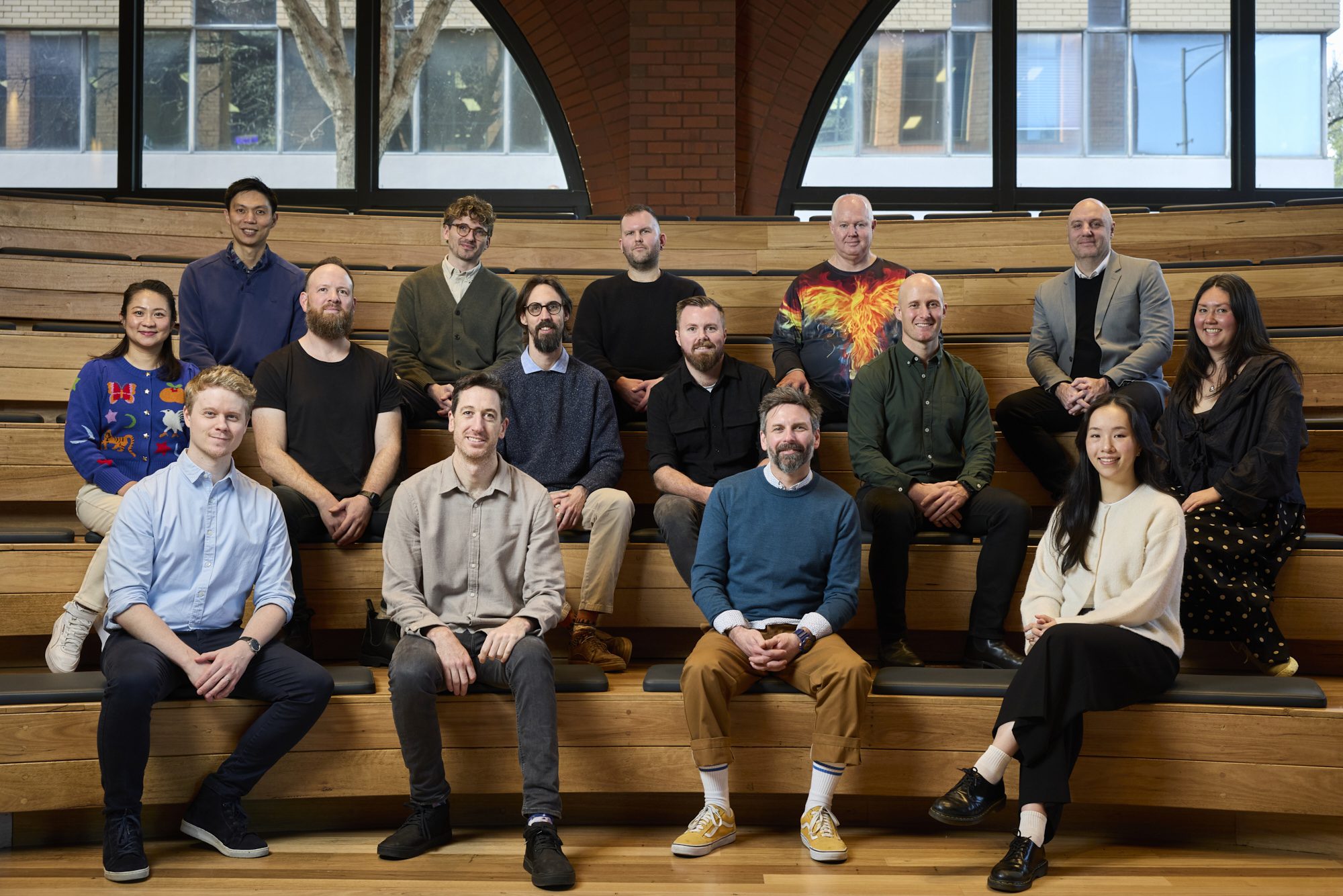 Conduct team group photo at Melbourne studio