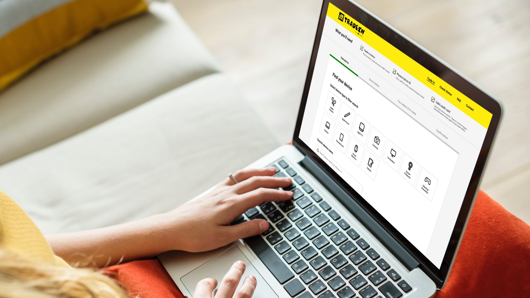 A customer using the JB Hi-Fi Trade-In platform on a laptop, built by Assurant and Conduct