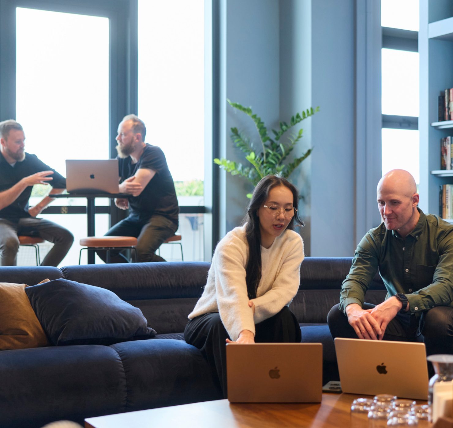 Conduct team collaborating in the Melbourne studio on social impact digital products