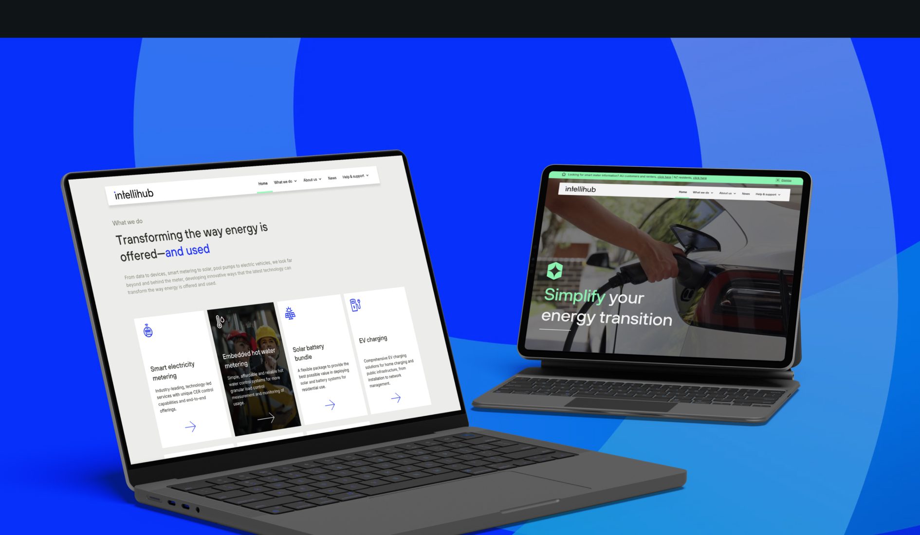 IntelliHub website shown on two laptops displaying smart metering products and EV charging pages