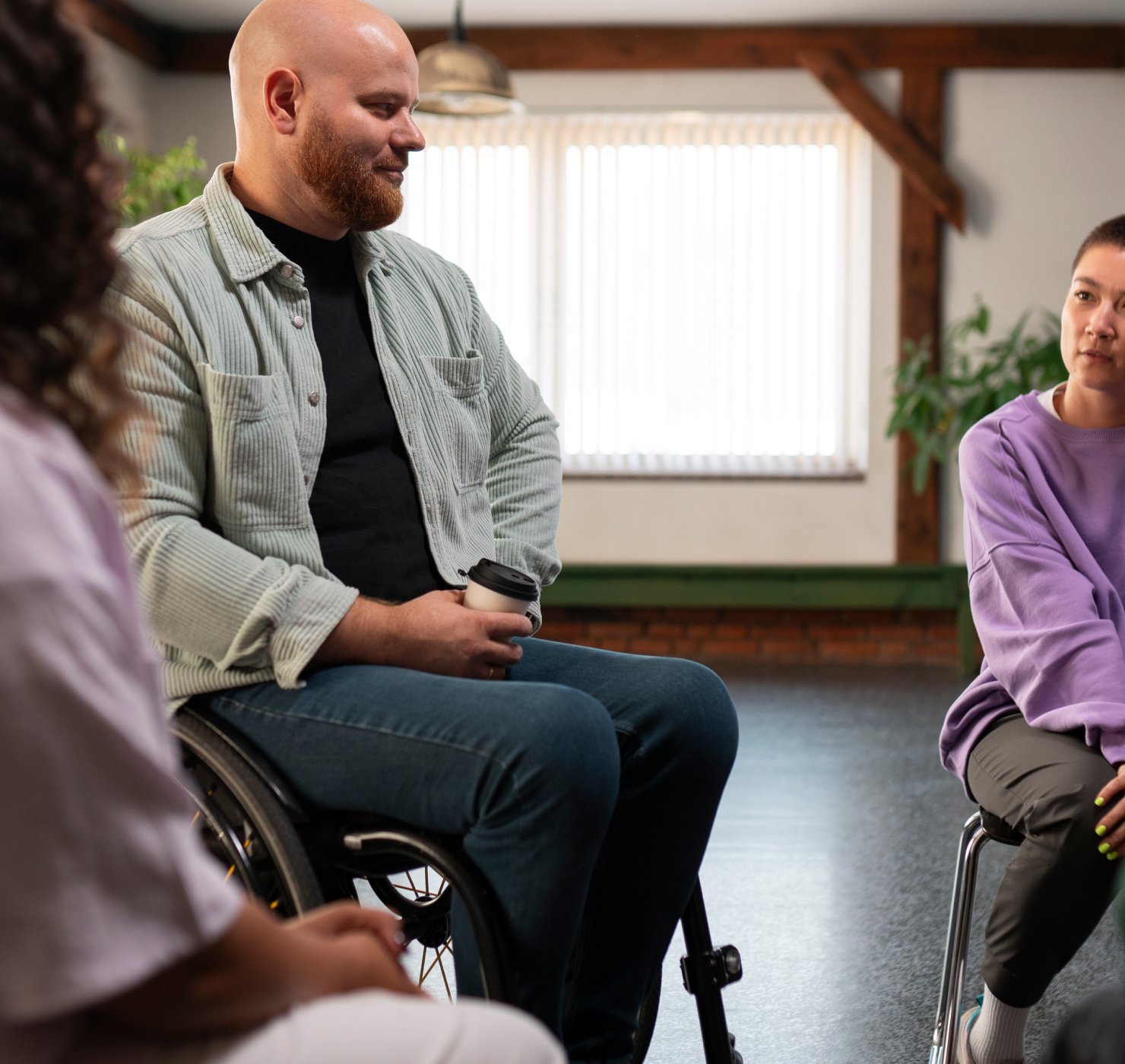 NDIS Commission research participants including a wheelchair user and people with lived experience in an inclusive interview session