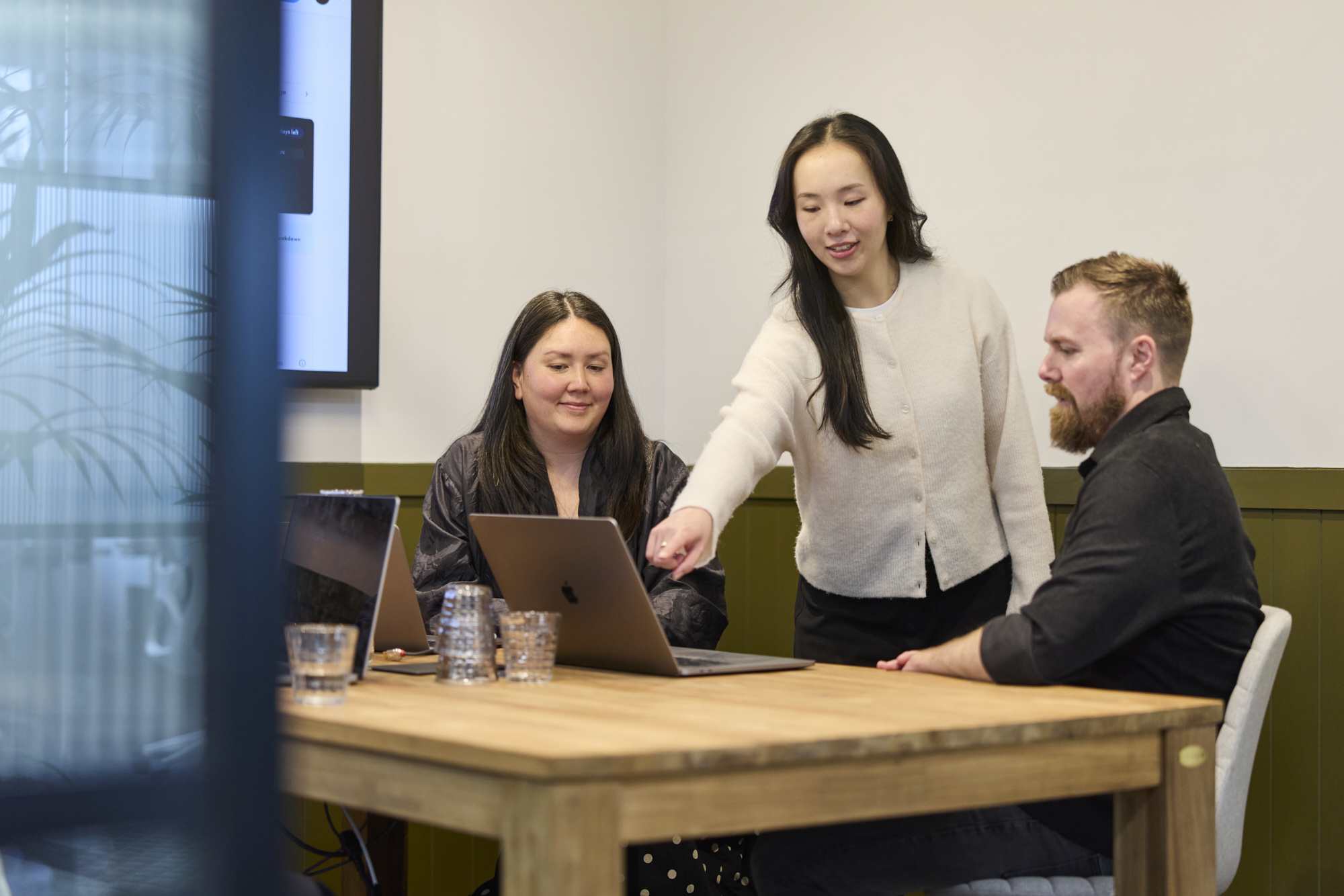 Conduct team in a meeting at the Melbourne studio