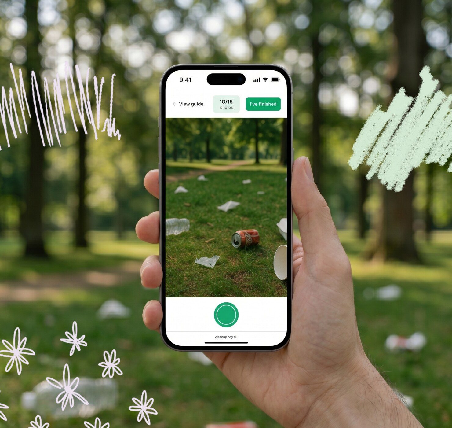 Volunteer holding phone running Clean Up CAM app to photograph litter in a public park during a clean-up event